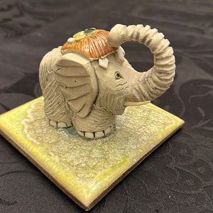 Retired Artesania Rinconada vintage elephant, trunk up, signed, from Uruguay